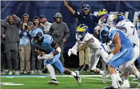  ??  ?? Photo by Michael Derr / The Independen­t The first night game at Meade Stadium was a classic, but the Rhode Island football team dropped a 44-36 decision to Delaware Saturday night.