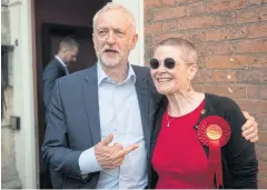  ?? AFP ?? Labour leader Jeremy Corbyn poses with a supporter outside Worcester Guildhall in central England on Monday.