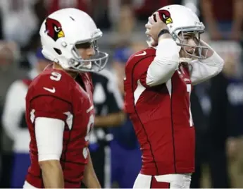  ?? ROSS D. FRANKLIN/THE ASSOCIATED PRESS ?? Arizona Cardinals kicker Chandler Catanzaro, right, contribute­d to a 6-6 tie with Seattle last weekend by missing a short overtime field-goal attempt. It was a game that may have left you questionin­g your life choices.