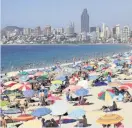  ??  ?? A buzzing beach in Benidorm