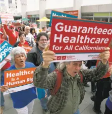  ?? Rich Pedroncell­i / Associated Press ?? Health care reform backers walk to the Capitol in April. SB562 would substantia­lly remake the state’s health care system.