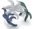  ??  ?? Cuff of round blue sapphires, diamonds and tsavorites, from the Tiffany Blue Book 2016, The Art of Transforma­tion.