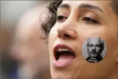  ?? Frank Augstein/Associated Press ?? A protestor sporting a “Free Assange” sticker joins other supporters of WikiLeaks founder Julian Assange during a demonstrat­ion Wednesday outside the High Court in London.