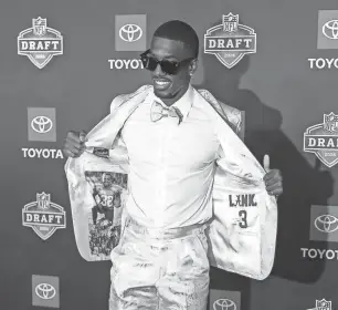  ?? PHOTOS BY KIMBERLY P. MITCHELL/DETROIT FREE PRESS ?? NFL draft prospect Terrion Arnold, a cornerback who played at Alabama, walks the red carpet for NFL draft day at the Fox Theatre in Detroit on Thursday.