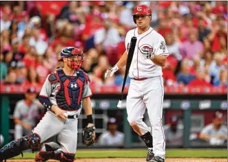  ?? GETTY IMAGES ?? Scott Schebler (right, in a July 14 game) hit .077 after the All-Star break, dropping his average from .254 to .228, before going on the 10-day disabled list. He’s eligible to come off the list this week.