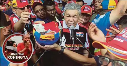  ?? PIC BY MOHD FADLI HAMZAH ?? Deputy Prime Minister Datuk Seri Dr Ahmad Zahid Hamidi collecting donations to help the Rohingya at the closing of Superbiker­s Associatio­n of Malaysia’s Merdeka Rides 2017 tour in Putrajaya yesterday.