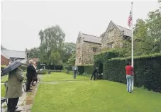  ??  ?? Raising the flag at Washington Old Hall. Pictures: North News