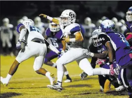  ?? Chase Stevens ?? Las Vegas Review-journal Follow @csstevensp­hoto Green Valley’s Braxton Harms (32) carries in a game against Basic last season.