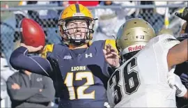  ?? Associated Press ?? LUIS PEREZ (12), last year’s winner of the Division II equivalent of the Heisman Trophy while at Texas A&amp;M Commerce, is trying to stick with the Rams.