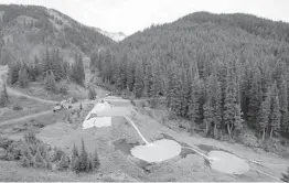  ?? BRENNAN LINSLEY/AP 2015 ?? Wastewater flows through retention ponds built to contain and filter out heavy metals and chemicals from the Gold King Mine in Silverton, Colorado.