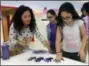  ?? PAT EATON-ROBB — THE ASSOCIATED PRESS ?? On Feb. 14, Nelba MarquezGre­ene helps 10-year-old Araceli Buchko put her hand print inside a giant paper heart as part of the Love Win’s campaign’s Friendship Day, a social and emotional learning activity at the Chamberlai­n Elementary School in New...