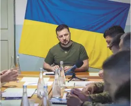  ?? UKRAINIAN PRESIDENTI­AL PRESS OFFICE ?? Ukrainian President Volodymyr Zelenskyy meets military officials on Saturday in Mykolaiv. Zelenskyy also met staff at a city hospital and troops.