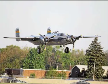  ?? MARK DUNCAN — THE ASSOCIATED PRESS FILE ?? A B-25 “Mitchell” bomber lands at Wright Patterson Air Force base in Dayton, Ohio Tuesday, April 17, 2012.