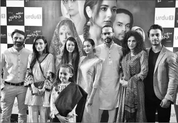  ??  ?? This photograph taken on Sept 7, 2017, shows Pakistani director Angeline Malik (2nd right) posing for a photograph with actors during a promotiona­l event for social drama serial ‘Mujhe Jeene Do’ (Let Me Live) in Karachi. — AFP photos by Asif Hassan