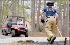  ?? Keith Bryant/The Weekly Vista ?? Fire inspector Gary Bowman (left) pilots the department’s new skid unit while Bella Vista firefighte­r Blake Barrett runs up to talk with him at a brush fire near the intersecti­on of Hallock Drive and Gates Lane on Tuesday, March 6. The compact truck was used three times that day alone, fire chief Steve Sims said.