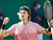  ?? BADIAS / ASSOCIATED PRESS JEAN-FRANCOIS ?? Andrey Rublev celebrates after defeating Rafael Nadal 6-2, 4-6, 6-2 in their quarterfin­al match of the Monte Carlo Tennis Masters in Monaco on Friday.