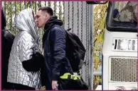  ?? ?? A Russian draftee kisses his partner before boarding a bus to be sent to the military units of the Eastern Military District