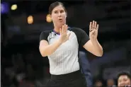  ?? NICK WASS — THE ASSOCIATED PRESS ?? Referee Natalie Sago gestures during the first half of an NBA basketball game between the Washington Wizards and the Detroit Pistons in Washington, in this Monday, Nov. 4, 2019, file photo. With more female referees now in the NBA than ever before, it was only a matter of time before two women would be scheduled to work the same game. And Monday, Jan. 25, 2021, became that day. Natalie Sago and Jenna Schroeder made up two-thirds of the crew assigned to the Charlotte at Orlando game, the first time in NBA history that two women would be working a regularsea­son contest together.