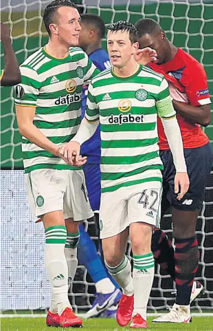  ??  ?? Happy Bhoys: Callum Mcgregor of Celtic celebrates with David Turnbull during Thursday’s win over Lille