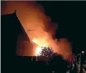  ??  ?? The house on fire in South Dunedin early yesterday morning.