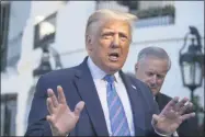  ?? ALEX BRANDON ?? President Donald Trump speaks with reporters as he walks to Marine One on the South Lawn of the White House, Wednesday, July 29, 2020, in Washington. Trump is en route to Texas.