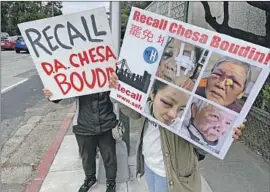  ?? Haven Daley Associated Press ?? PEOPLE supporting the recall of San Francisco Dist. Atty. Chesa Boudin urge motorists in May to vote him out. Boudin was recalled from office on Tuesday.