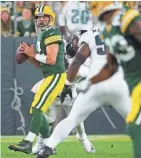  ?? MARK HOFFMAN / JOURNAL SENTINEL ?? Cornerback­s and safeties have trouble reading the eyes of Packers quarterbac­k Aaron Rodgers as he sometimes doesn’t look back at the receiver he is throwing to.