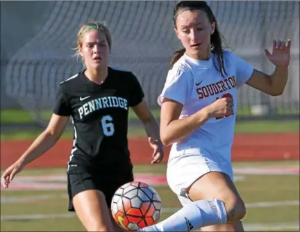  ?? BOB RAINES — DIGITAL FIRST MEDIA ?? Souderton’s Cara McCausland redirects the ball with her heel away from Pennridge’s Lauren McIntyre Tuesday.