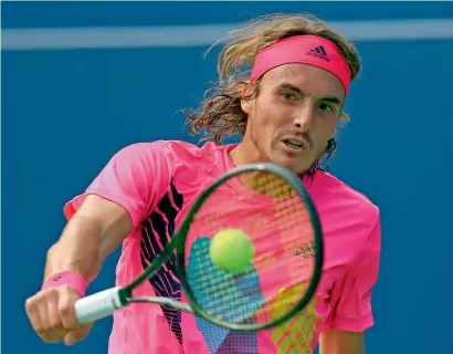  ?? AFP ?? Stefanos Tsitsipas plays a shot against Novak Djokovic during their third round match on Day 4 of the Rogers Cup. —