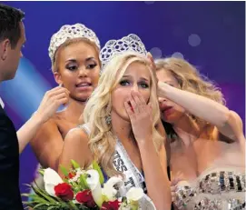  ?? DARREN DECKER/AFP/GETTY IMAGES ?? Newly crowned Miss Teen USA 2013, Cassidy Wolf went to the police to report a hacker’s email message that tried to extort nude photos from her. FBI agents believe they have identified a suspect.