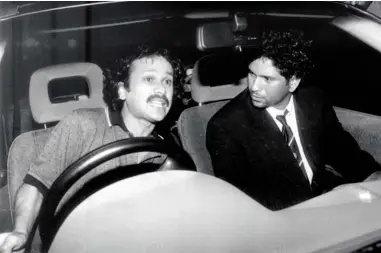  ?? INDIAN EXPRESS ?? ( ABOVE ) SACHIN RIDING SHOTGUN WITH HIS BROTHER AND MENTOR AJITTENDUL­KAR IN 1998; ( BELOW, FROM LEFT) POSING WITH HIS SON ARJUN, DAUGHTER SARAAND WIFE ANJALI NEXT TO HIS WAXSTATUE AT MADAME TUSSAUDS, LONDON, IN 2009