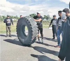  ??  ?? A contestant in action during the giant tyre flip segment of the ‘Strongman Challenge’.