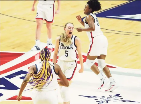  ?? David Butler II / USA Today ?? UConn guard Paige Bueckers (5) and teammates react after a basket against Marquette in the Big East Tournament championsh­ip game March 8.