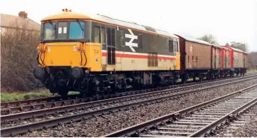  ??  ?? BELOW: Class 73/1 73139 in large logo livery heads for Andover at Red Post Bridge with vans in tow on March 31, 1988. (Author)