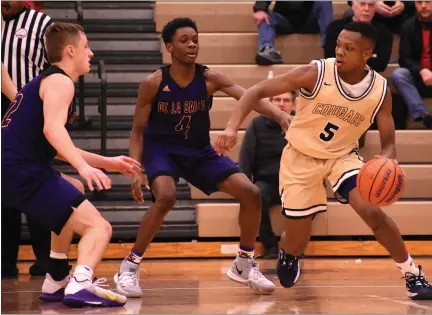  ?? MEDIANEWS GROUP FILE PHOTOS ?? Boys basketball teams, along with other winter high school sports, are currently unable to conduct contact practices or competitio­ns until at least Feb. 22under the current epidemic order from the Michigan Department of Health and Human Services.