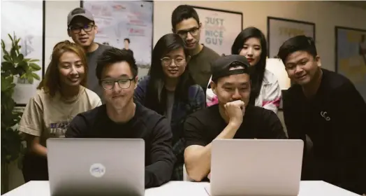  ?? Wong Fu Production­s ?? Co-founders Philip Wang (front right), Wesley Chan (front left) with the rest of Wong Fu Production­s’ current team.