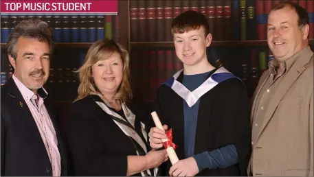  ??  ?? Patrick Smyth A.V.C.M (Hons.) is presented with a Honours Diploma recently in Drogheda by his teacher Pat Harty on behalf of the Victoria College of Music and Drama , London. Patrick was a pupil of the Crilly School of Music , Drogheda also in the...