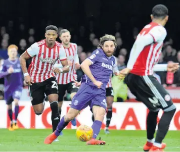  ??  ?? PASS MASTER: Joe Allen looks to start off a Stoke City attack at Griffin Park.