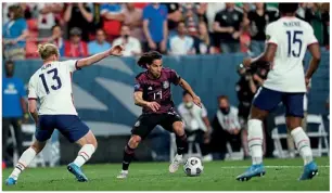  ??  ?? Starlet…Mexico’s Diego Lainez teases the United States defence