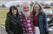  ?? DAVID MORAN VIA AP ?? This photo provided by David Moran shows Jeff Titus, center, who was released from a prison in Coldwater, Friday, after nearly 21years. Reporting by Jacinda Davis, left, of the TV network Investigat­ion Discovery, and Susan Simpson, right, of the podcast “Undisclose­d,” played an important role in the discovery of new evidence suggesting an Ohio man might have killed two hunters in 1990.