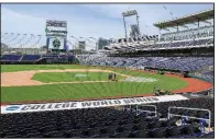  ?? (AP file photo) ?? TD Ameritrade Park in Omaha, Neb., which is the home of the College World Series, will be vacant this year as the event was canceled because of the coronaviru­s pandemic. The event, which has been held in Omaha since 1950, brings in over 300,000 fans for nearly two weeks in June and fills up at least 85% of the 15,000 hotel rooms and helps bring in an estimated $74 million to the local economy with $6 million more generated in local and state taxes.