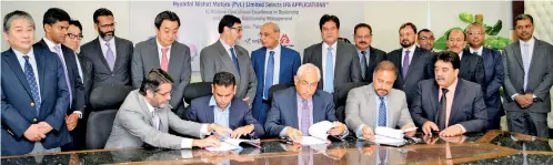  ??  ?? Signing from left: Hyundai Nishat Motor (Pvt.) Ltd Chief Executive Officer Hassan Mansha, Millat Tractors Ltd Chief Executive Office Irfan Aqueel and IFS Managing Director and South Asia Sales Vice President Shiraz Lye at the agreement singing ceremony