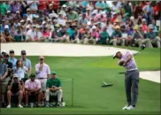  ?? AP - Charlie Riedel ?? Tiger Woods hits from the third tee during the third round for the Masters on Saturday.