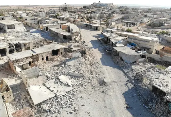  ?? AFP ?? THIS aerial photo shows a view of destructio­n and damaged buildings from Syrian government forces’ bombardmen­t in the village of Al-Tahh, in the northweste­rn Idlib province.