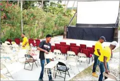  ?? PIERRE MICHEL JEAN/AFP ?? People set up for a film projection next to a beach in Jacmel, southern Haiti, on Thursday.