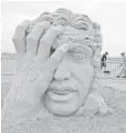  ?? SANDING OVATIONS ?? It’s heads up at the Revere Beach National Sand Sculpting Festival north of Boston.