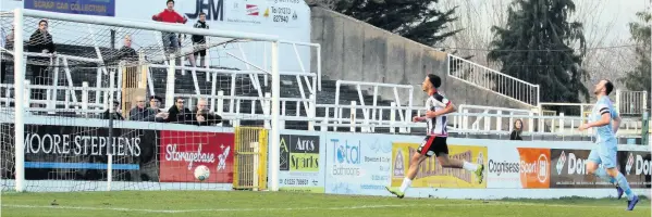  ??  ?? Freddie Hinds rounds the goalkeeper to open the scoring for Bath City against Slough Town