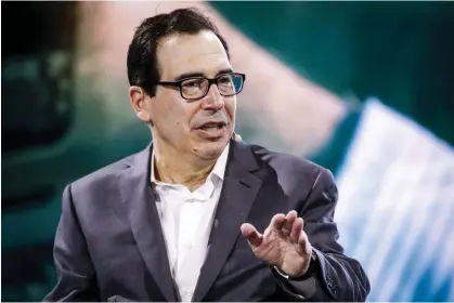  ?? Photograph: Marco Bello/Bloomberg via Getty Images ?? Steven Mnuchin, former treasury secretary, at a summit in Miami, Florida, 30 March 2023.