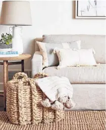  ?? KELLI BOYD ?? Well-made baskets are unsung heroes that can easily go from room to room and work like pieces of furniture. Use them for items you need to corral or hide: firewood, toiletries, remote controls, toilet paper, mail, towels, laundry, shoes, socks and umbrellas.