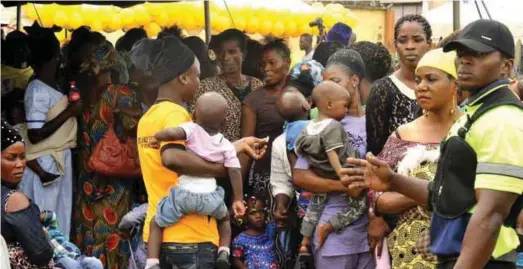  ??  ?? Mothers and their children at the IIF event at Ikorodu